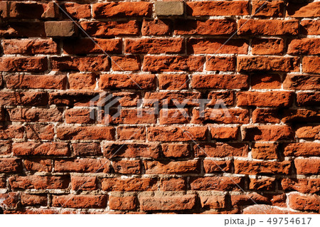 Old brown brick wall texture background 49754617