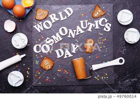 Text is World Cosmonautics day and cookies in form of astronaut, rocket, flying saucer and alien. 49760014