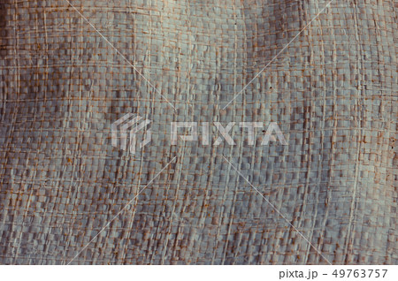 Old and dust plastic woven sack background 49763757