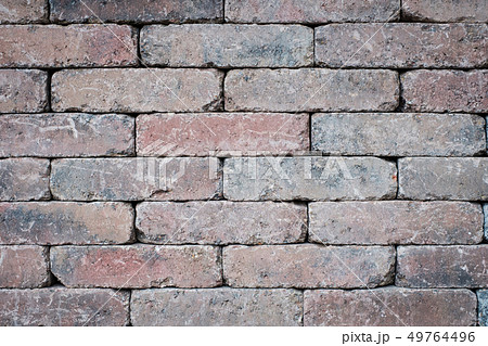 old brick wall closeup - tiled stone background 49764496
