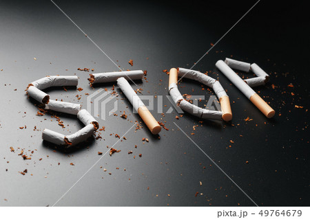 The inscription STOP from cigarettes on a black 49764679