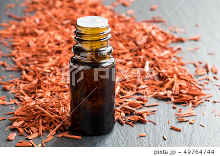 A bottle of sandalwood essential oil with 49764744