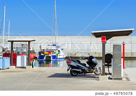 Motor Scooter, fuel dispenser in port Blanes Spain 49765078