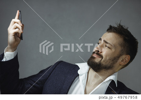 Man in Suit with Phone 49767958