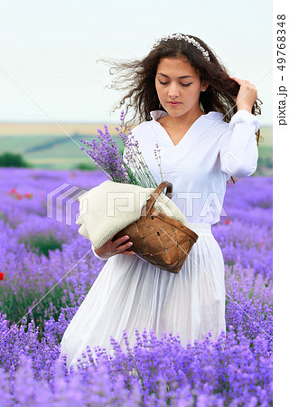young woman is in the lavender flower field, 49768348