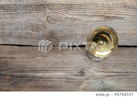 Glass of white wine 49768547
