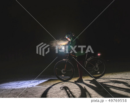 MTB race on large tire wheels in fresh snow 49769558