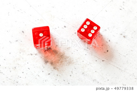Two red craps dices showing Natural or Seven Out number 1 and 6 overhead shot on white board Two red craps dices showing Natural or Seven Out number 1 and 6 overhead shot on white board 49779338