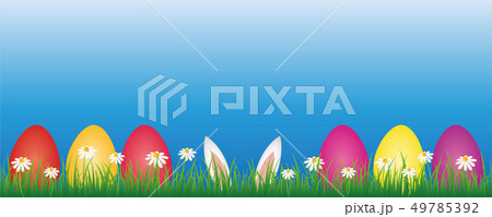 bunny ears and colorful easter eggs in green meadow with white daisy flowers banner with copy space 49785392