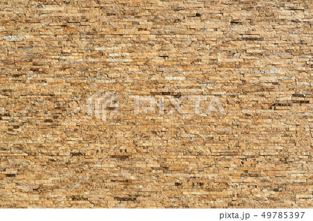Stone wall of natural stones in different sizes. 49785397
