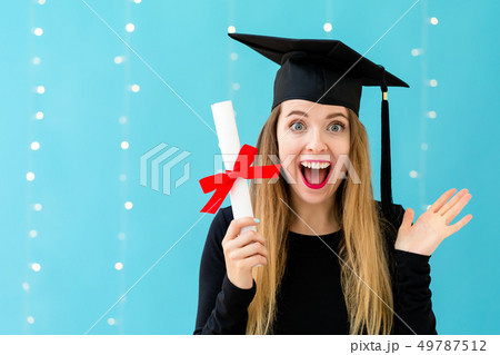 Young woman with a graduation diploma 49787512