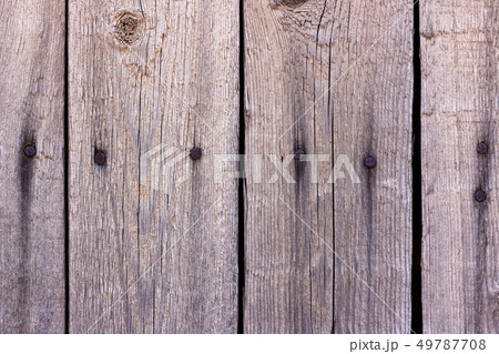 Old unpainted fence boards as a background Old unpainted fence boards as a background 49787708