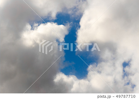 Snow-white fluffy Clouds on a blue sky Snow-white fluffy Clouds on a blue sky 49787710