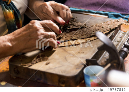 Woman making cigar - Trinidad - Cuba Woman making cigar - Trinidad - Cuba 49787812