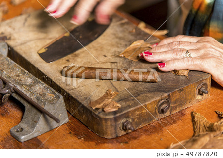 Woman making cigar - Trinidad - Cuba Woman making cigar - Trinidad - Cuba 49787820