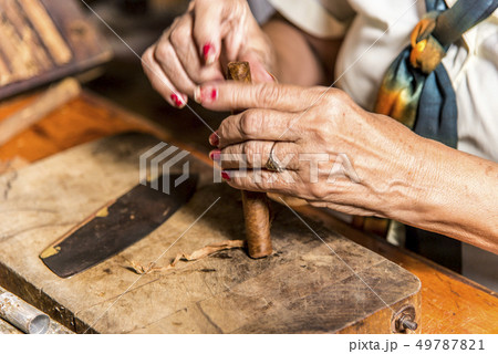 Woman making cigar - Trinidad - Cuba Woman making cigar - Trinidad - Cuba 49787821