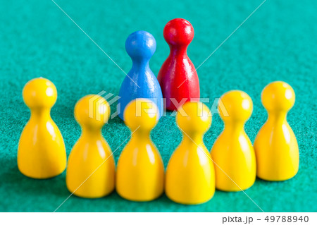 blue and red pawns in front of yellow pawns 49788940
