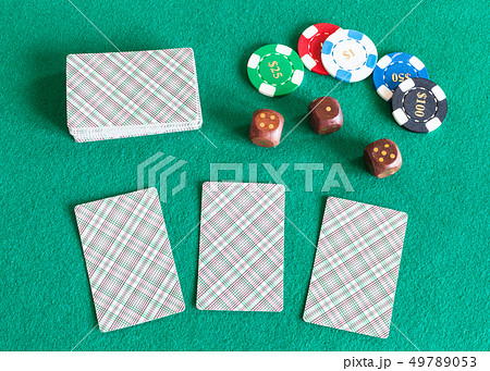 card decks, casino tokens and dices on table card decks, casino tokens and dices on table 49789053