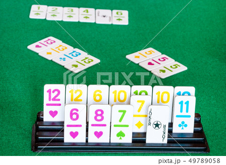 tiles in rack and board during playing in Rummy 49789058