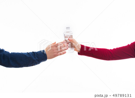 hands giving bottle of water 49789131