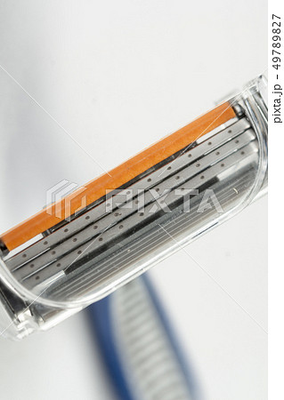 Modern Razor Blade With Three Razors Above White 49789827
