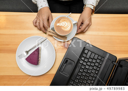 View from above on woman hands on wooden table 49789983