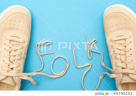 Women sneakers with laces in folk text. 49790201