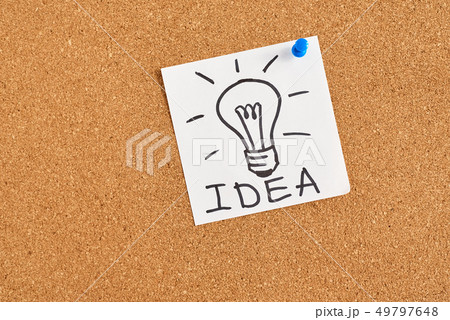 painted light bulb with word idea on a cork board painted light bulb with word idea on a cork board 49797648