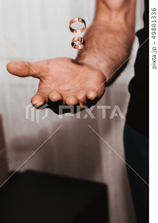 the groom throws the wedding rings in the air 49801336