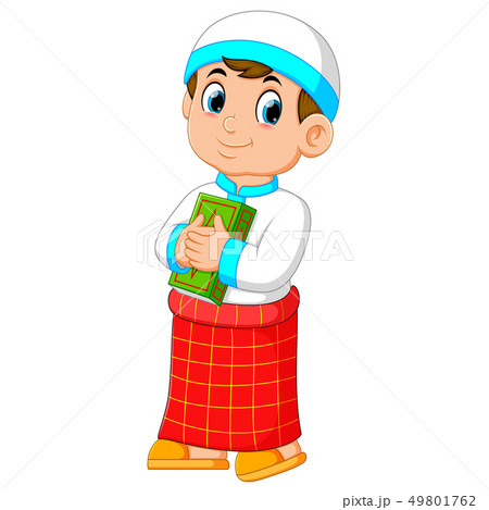 the good boy is holding his green al quran 49801762