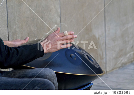 street performer playinh hang metal drum street performer playinh hang metal drum 49803695