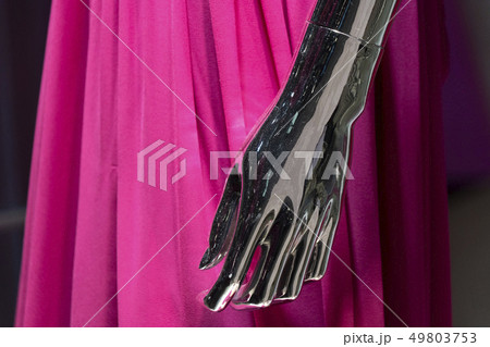 Silver woman mannequin hand detail with pink dress 49803753
