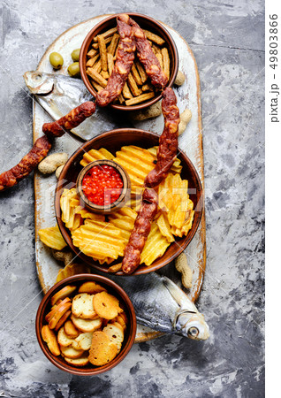 Beer snacks on stone table Beer snacks on stone table 49803866