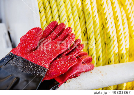 Fishing gloves covered with sand 49803867