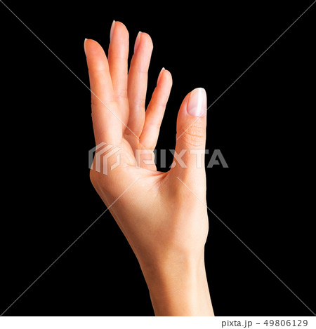 Woman hand holding something with two fingers 49806129