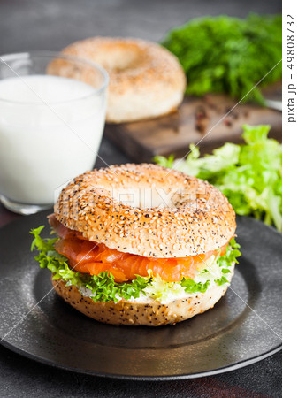 Fresh healthy bagel sandwich with salmon, ricotta 49808732