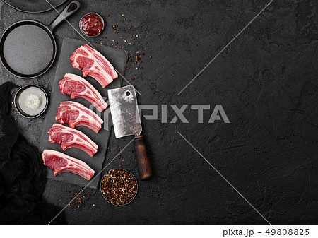Fresh raw butchers lamb beef cutlets on stone Fresh raw butchers lamb beef cutlets on stone 49808825