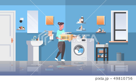 woman with basket of clothes standing near washing machine housewife doing housework modern bathroom woman with basket of clothes standing near washing machine housewife doing housework modern bathroom 49810756