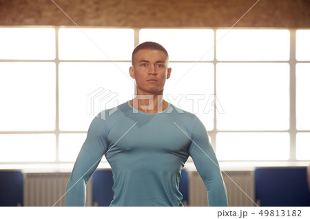 Portrait of Young Strong Man Training in Gym 49813182