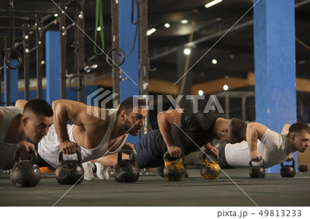 Fit Healthy Men Training Together in Gym. Fit Healthy Men Training Together in Gym. 49813233