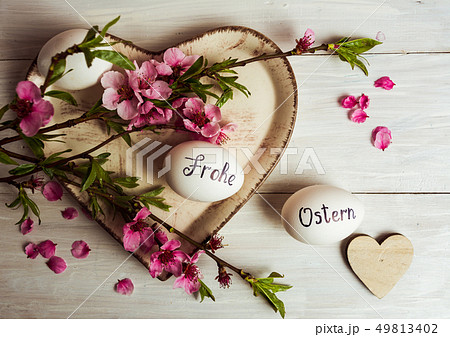 Frohe Ostern written on eggs Frohe Ostern written on eggs 49813402