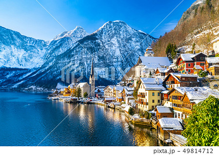 Classic postcard view of famous Hallstatt lakeside town in the Alps with traditional passenger ship 49814712