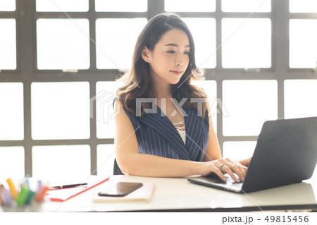 Portrait of smiling pretty young Asian business 49815456