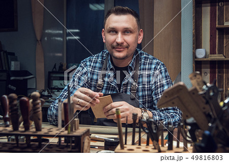 Concept of handmade craft production of leather goods. 49816803