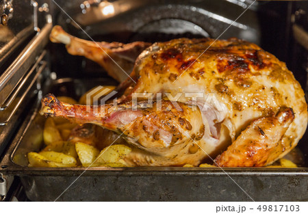 Turkey is baked in the oven closeup Turkey is baked in the oven closeup 49817103