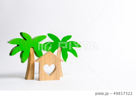 Wooden palm tree and house with hearts Wooden palm tree and house with hearts 49817322