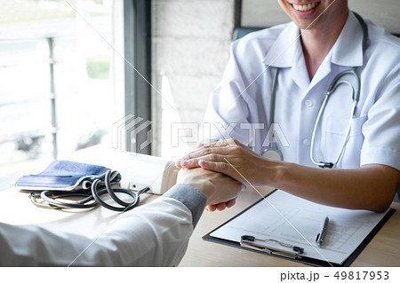 Image of doctor holding patient's hand to Image of doctor holding patient's hand to 49817953