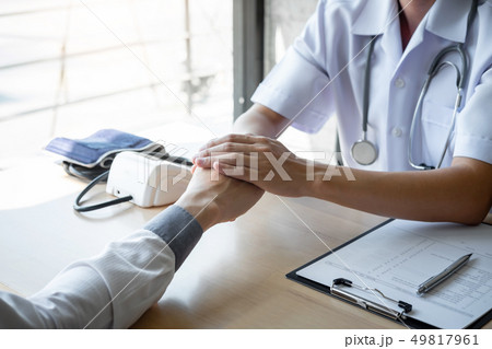 Image of doctor holding patient's hand to Image of doctor holding patient's hand to 49817961