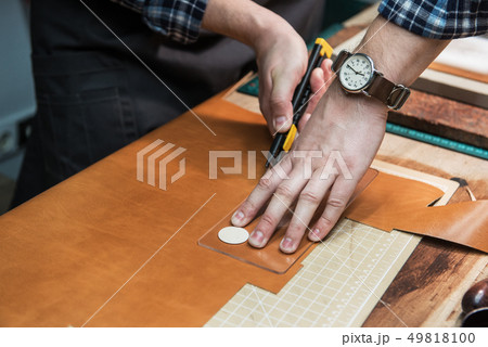 Concept of handmade craft production of leather goods. 49818100
