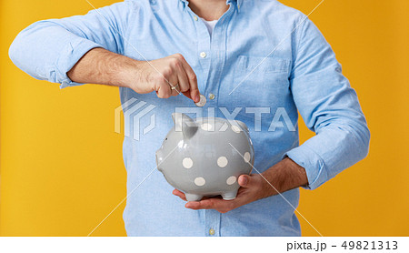 concept of Finance and business. man with piggy concept of Finance and business. man with piggy 49821313